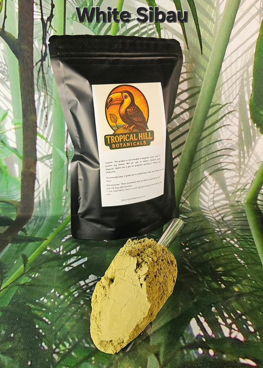 White Sibau strain above black pouch with 'Tropical Hill Botanicals' label on a green leafy background, scoop of fine kratom powder